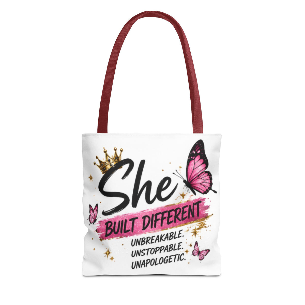 Maroon-strapped tote bag with 'She Built Different' lettering and pink butterfly graphic