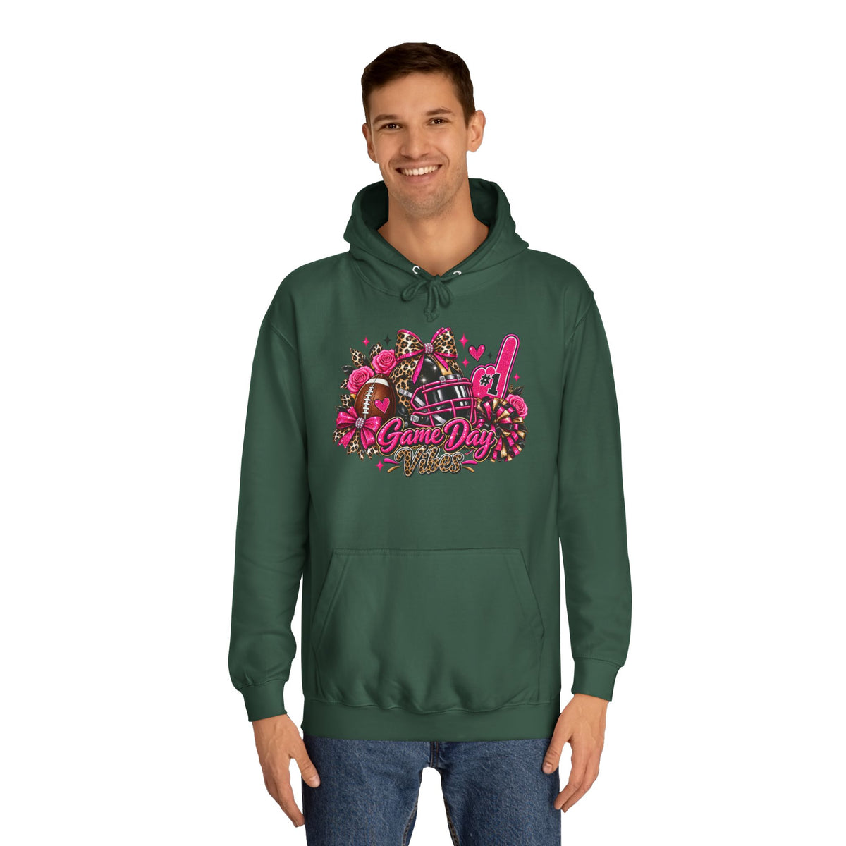 Game Day Cheer Hoodie — Pink Football Floral Design by Printify, dark green hoodie with pink football, floral, pom-pom, and Game Day graphic worn by a smiling model