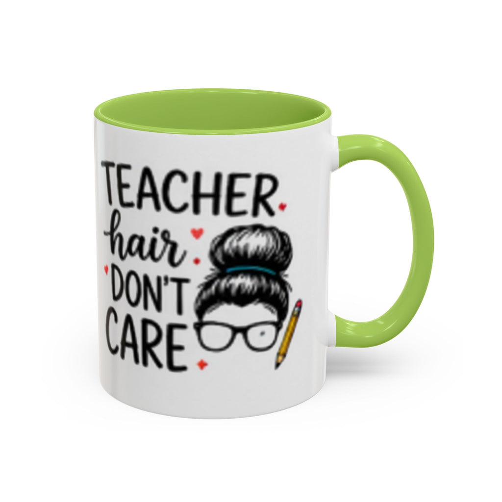 White coffee mug with green handle and interior, “TEACHER hair DON’T CARE” print.
