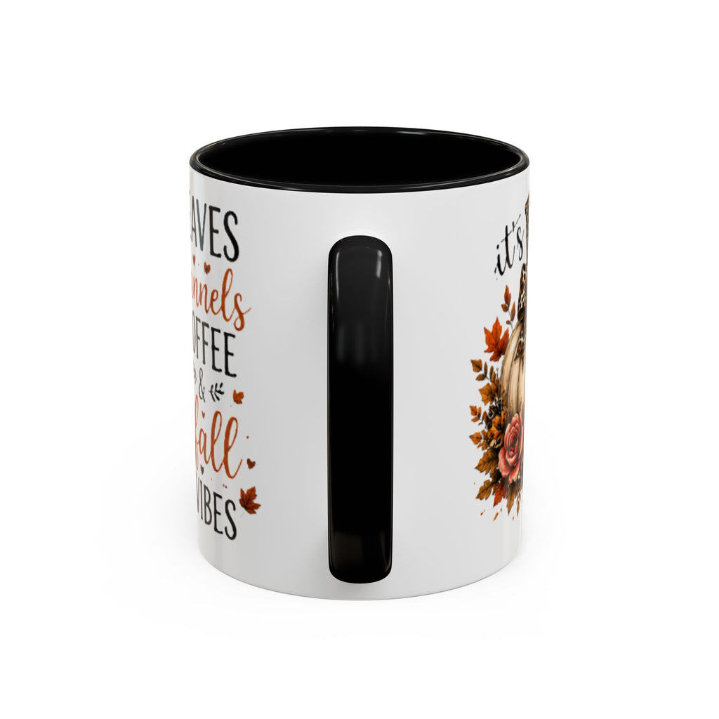 White coffee mug with black interior and vertical black accent, fall leaves text on side.