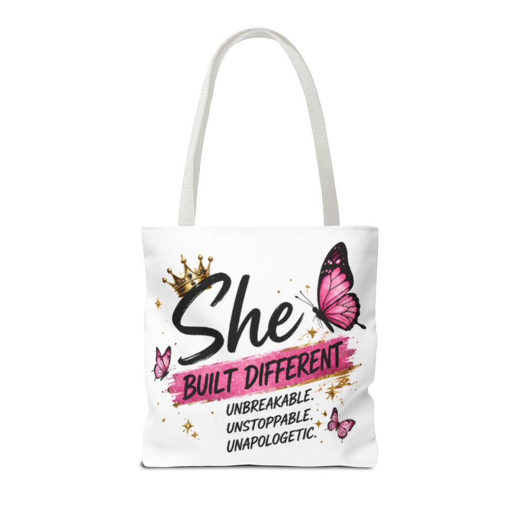 White tote bag with light gray handles, front design with butterfly and “She Built Different”.