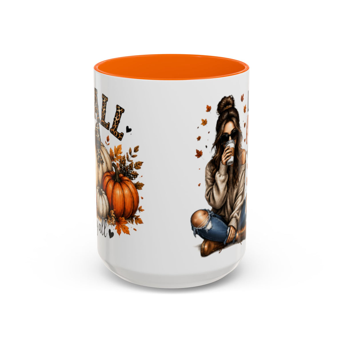 White autumn coffee mug with orange interior rim, woman sipping drink and pumpkin graphic.