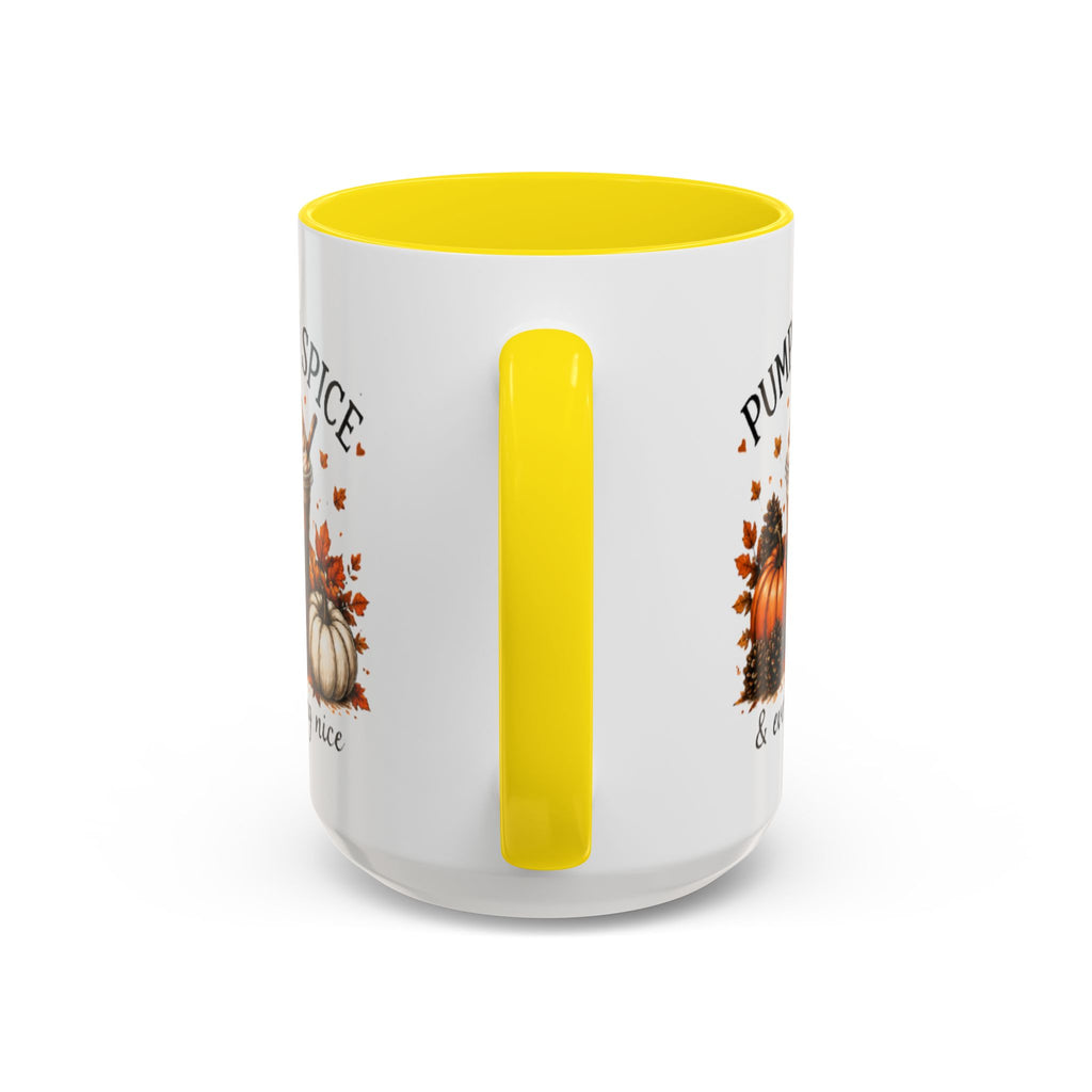 White coffee mug with yellow vertical handle accent and partial “PUMPKIN SPICE” text.