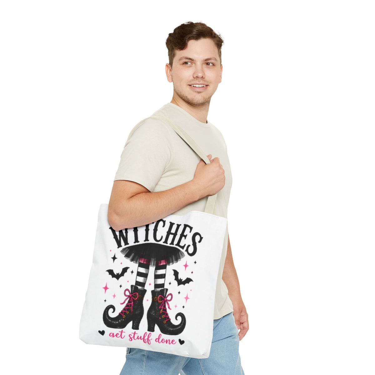 Cream canvas tote bag carried on shoulder with witch legs graphic and 'get stuff done'
