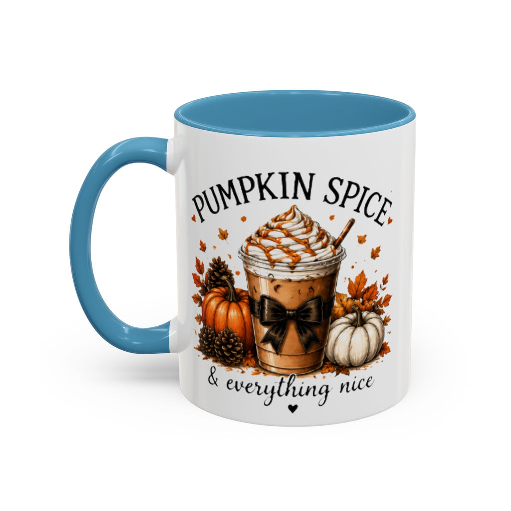 White coffee mug with light blue handle, top rim, and Pumpkin Spice seasonal graphic.