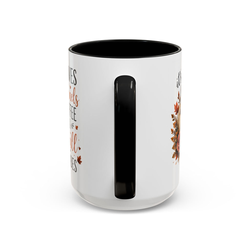 White coffee mug with black interior and handle, featuring autumn leaf and pumpkin print