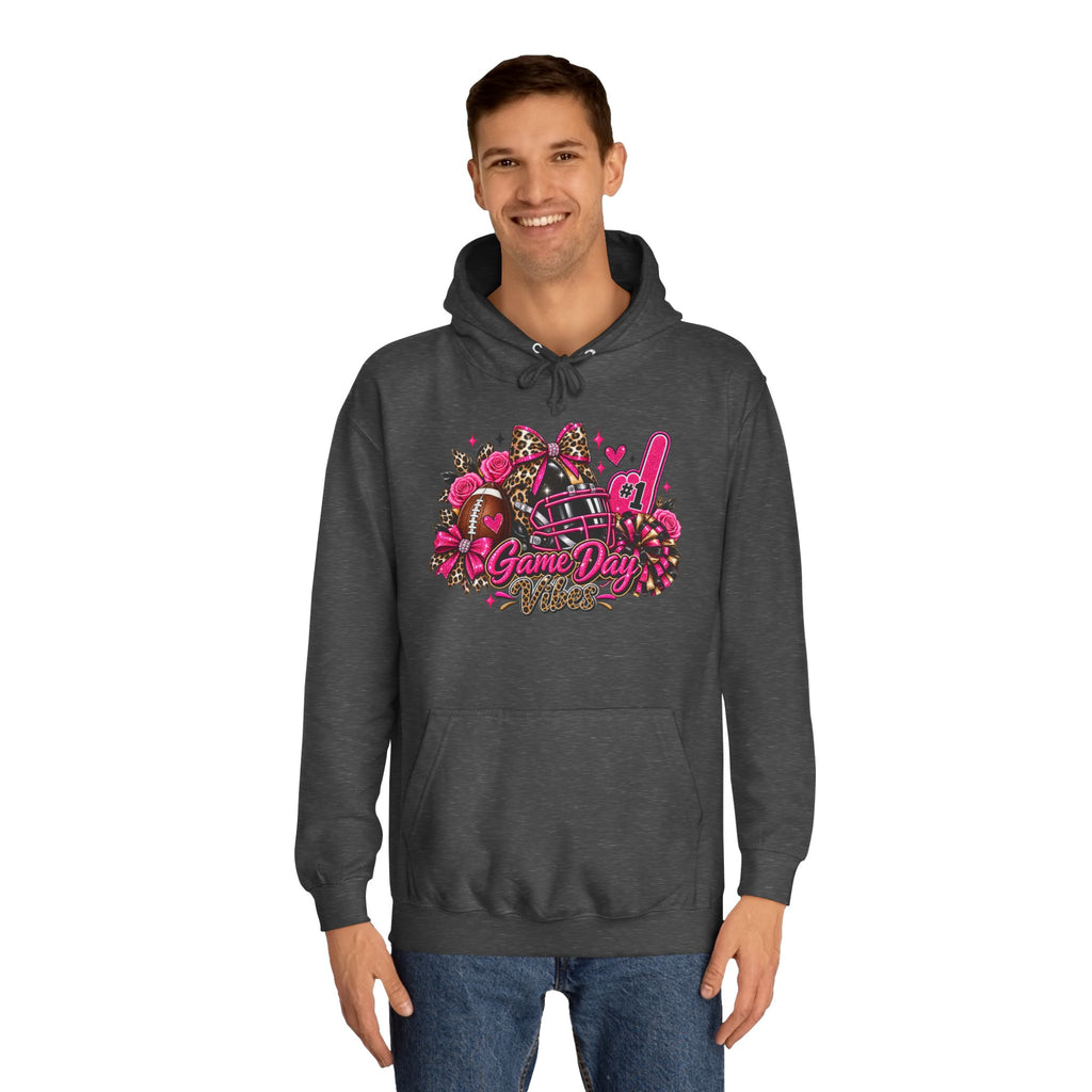 Game Day Cheer Hoodie — Pink Football Floral Design by Printify, modeled in a dark gray hoodie with a colorful football, cheer, floral, and game day graphic