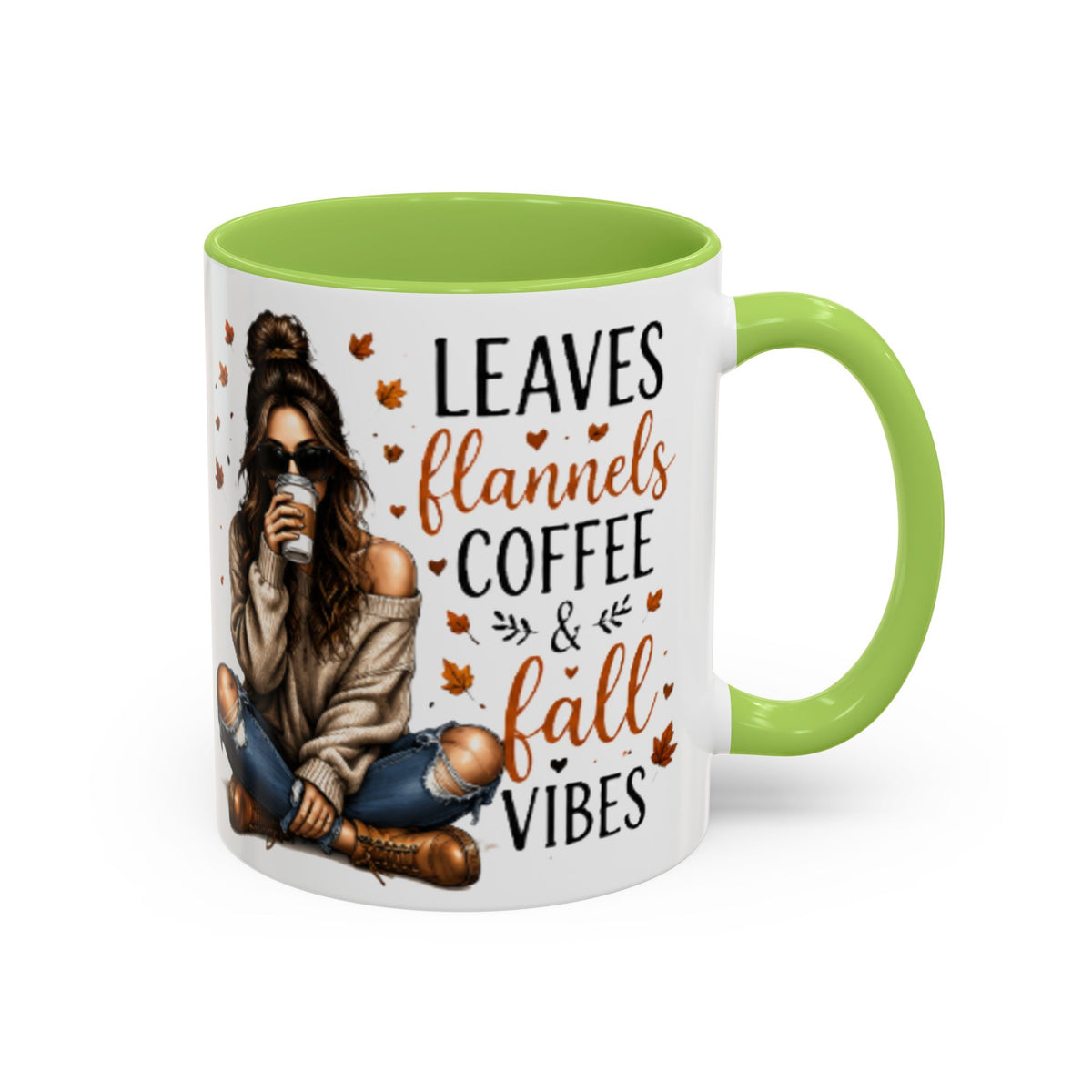 White ceramic coffee mug with light green handle and interior, “Leaves flannels coffee & fall vibes”