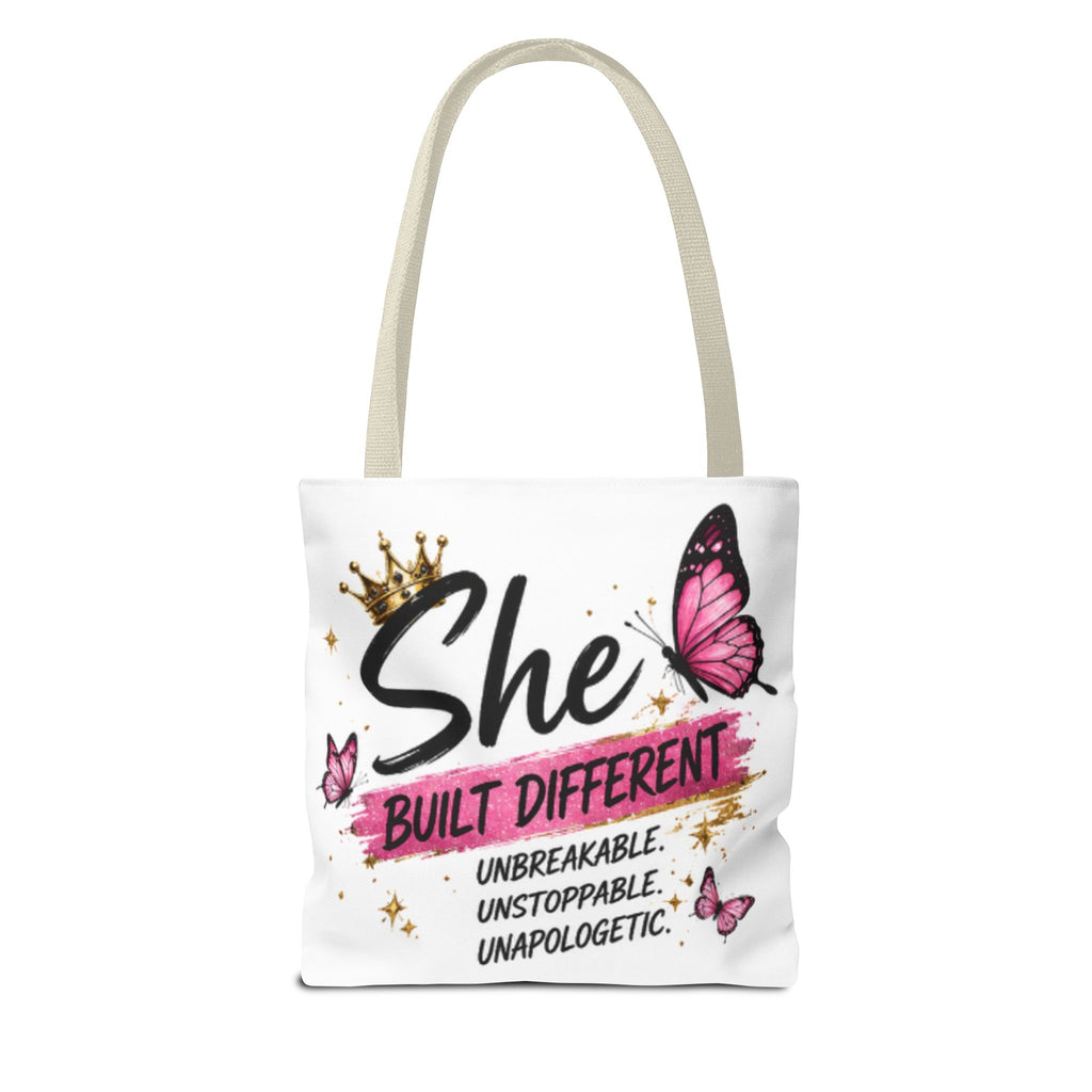 White canvas tote bag with butterfly graphic and crown, “She Built Different” lettering front