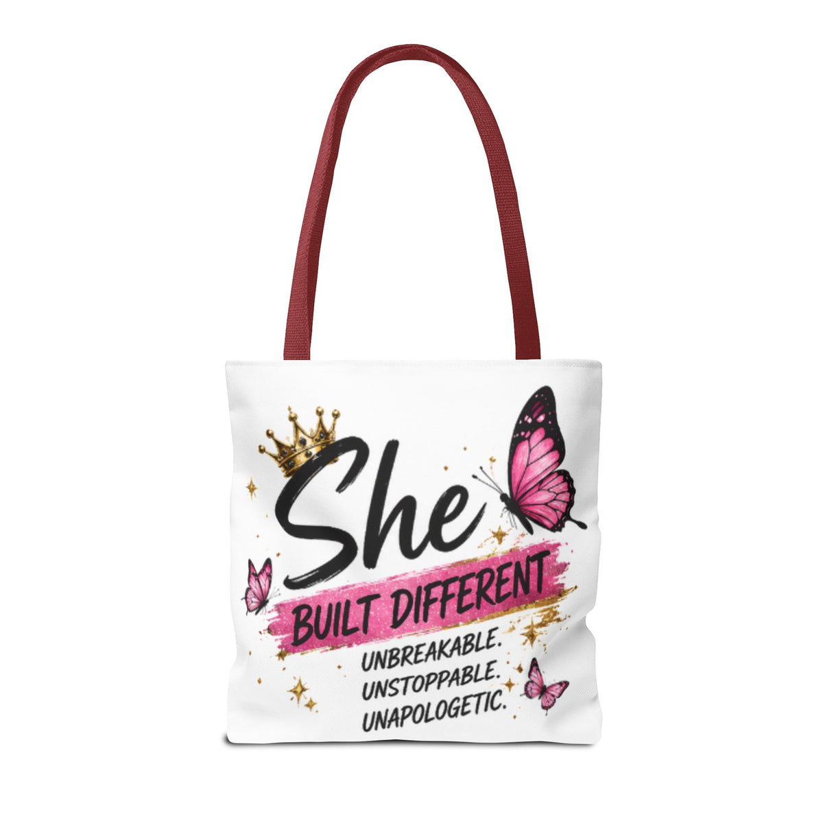 White tote bag with burgundy handles, “She Built Different” slogan and pink butterflies