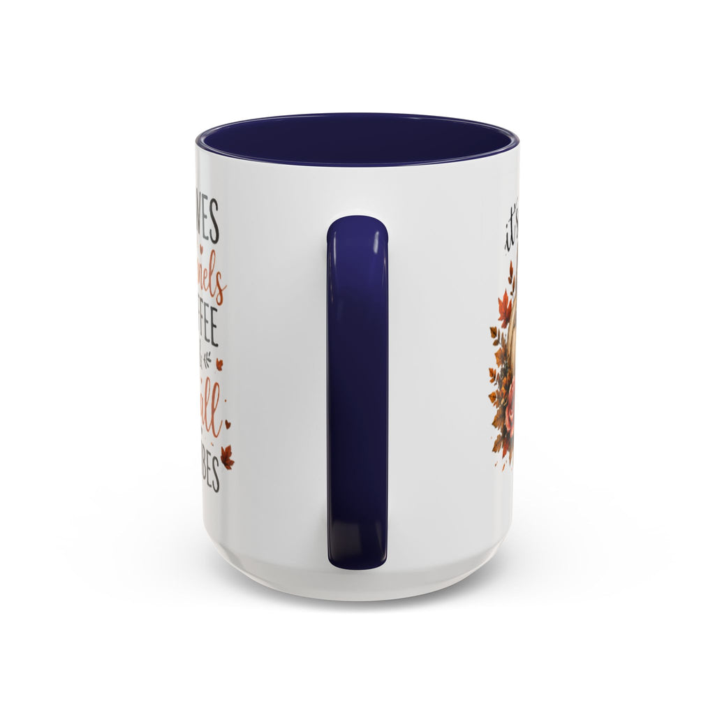 White coffee mug with navy interior and handle, autumn leaves and pumpkin graphic on side