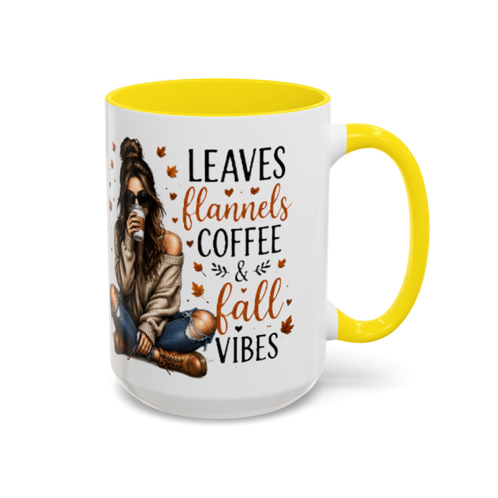 White ceramic coffee mug with yellow handle and interior, “Leaves flannels coffee & fall vibes”