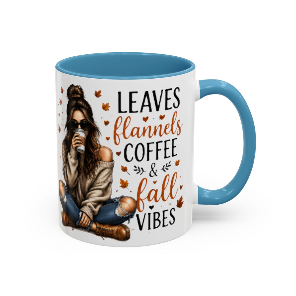 Autumn coffee mug with light blue handle, white body, “Leaves flannels coffee & fall vibes” print