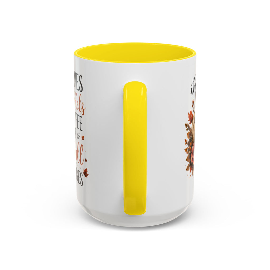 White coffee mug with yellow interior and handle, partial autumn text graphic on side