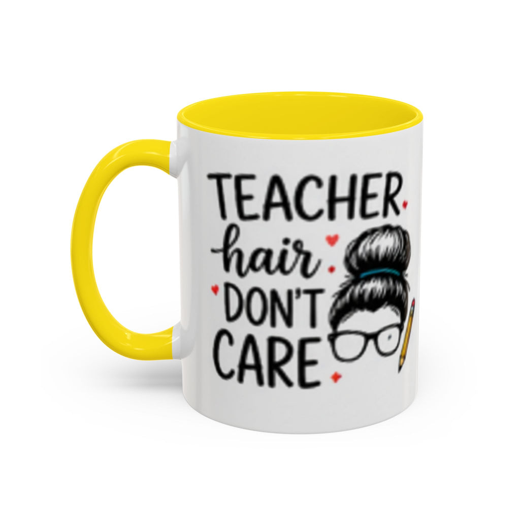 White coffee mug with yellow handle and interior, teacher hair “DON’T CARE” graphic.