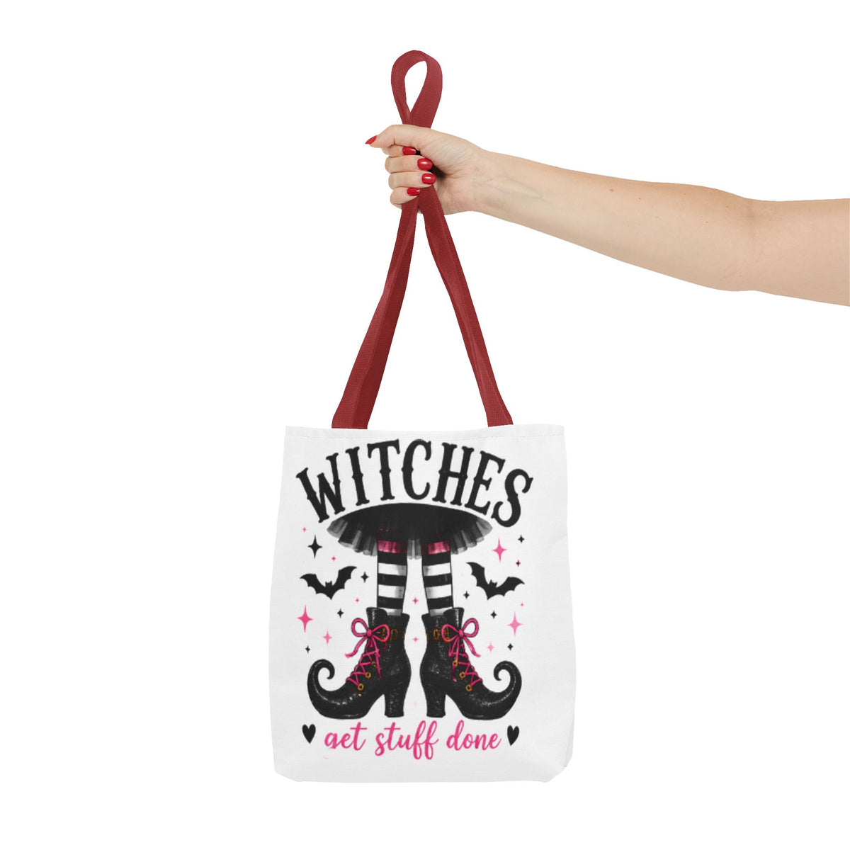 White canvas tote bag with burgundy handles and witch boots graphic, front print centered.