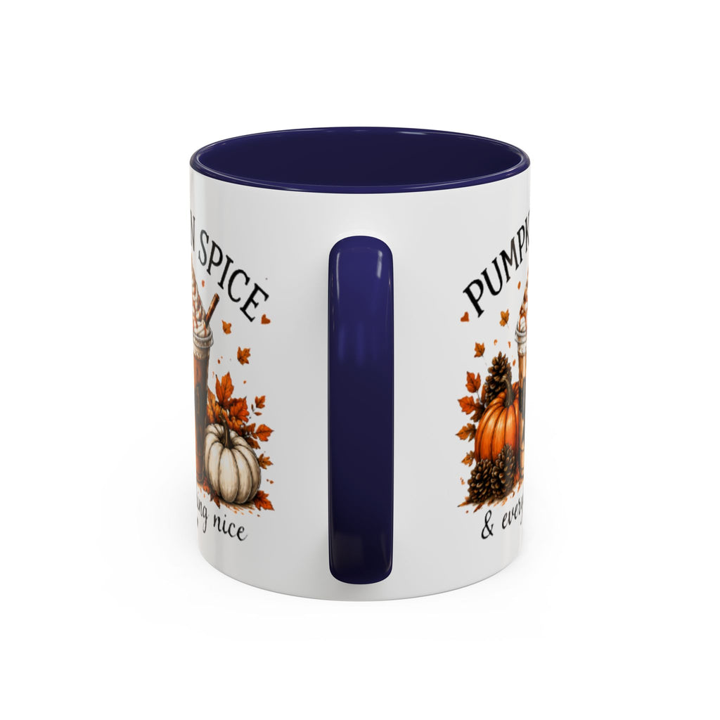 White coffee mug with navy interior; partial “Pumpkin Spice” text and fall pumpkin graphics