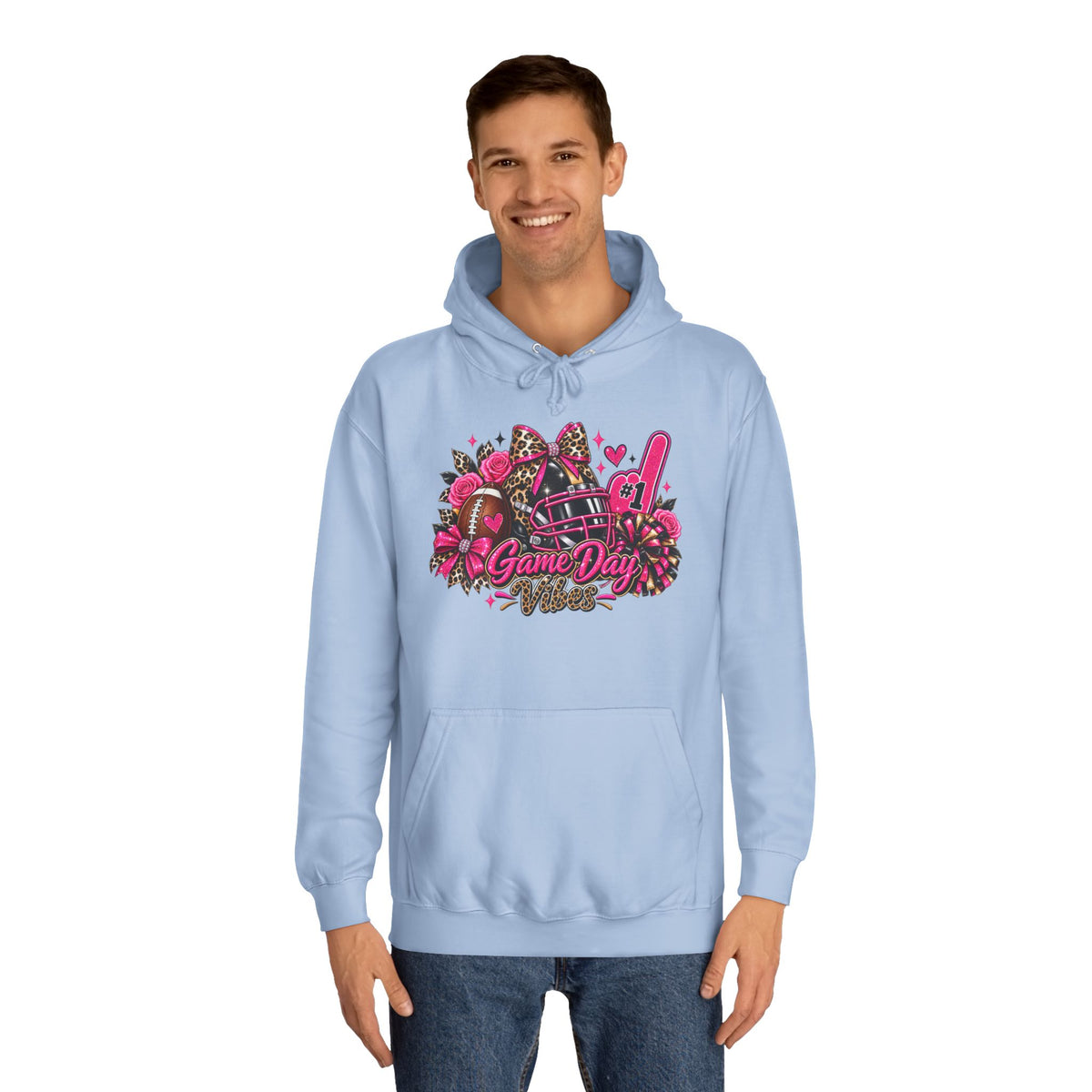 Printify Game Day Cheer Hoodie — Pink Football Floral Design, light blue pullover hoodie modeled with a colorful game day football, helmet, pom-poms, and floral graphic