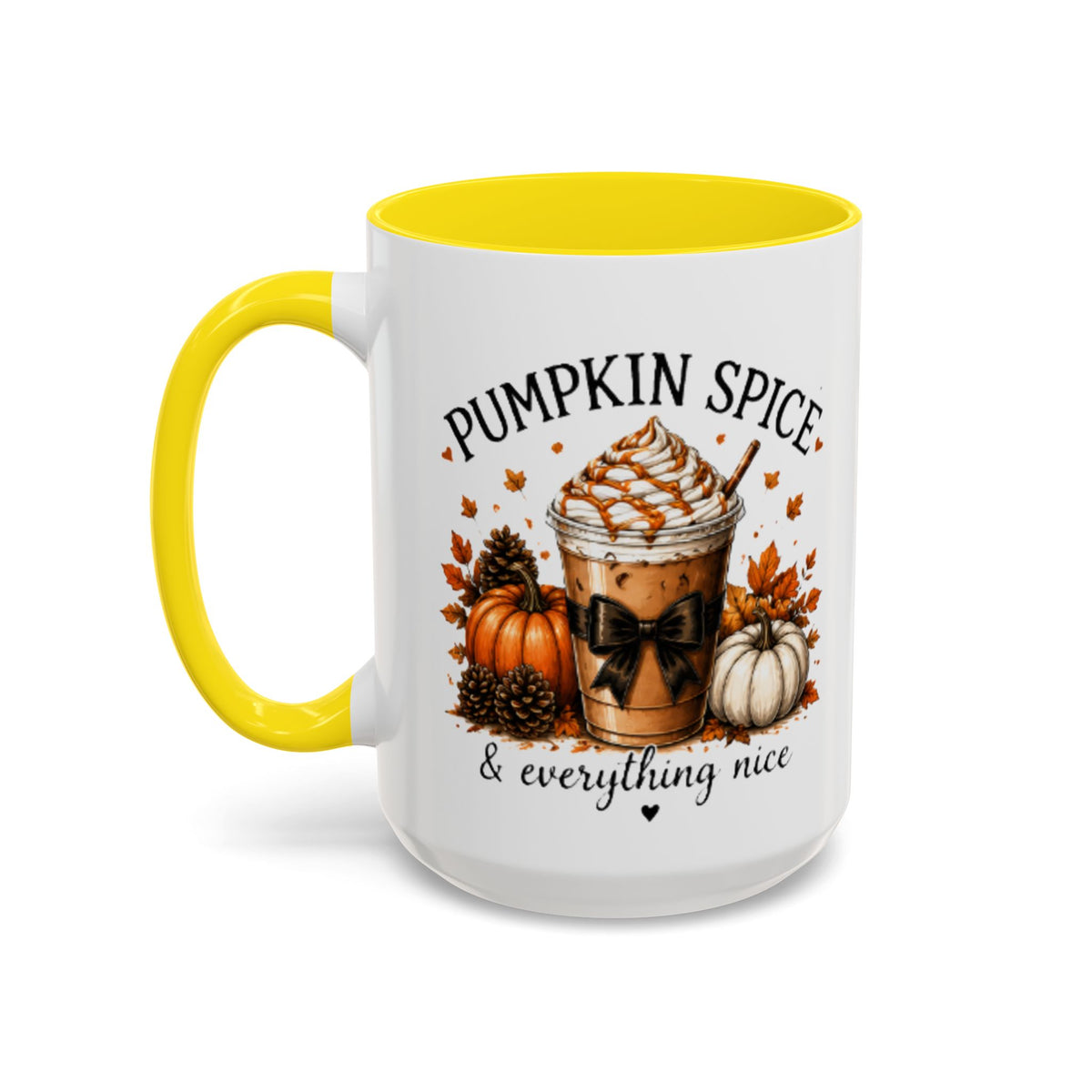 White coffee mug with yellow rim and handle, “PUMPKIN SPICE & everything nice” design.