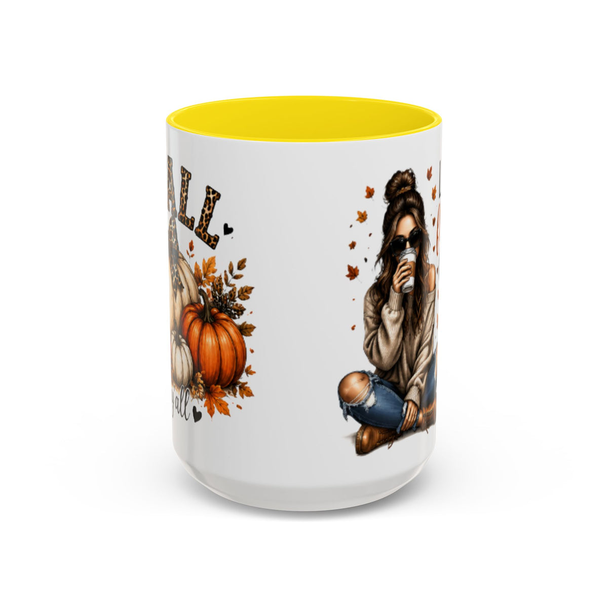 White autumn coffee mug with yellow interior rim, woman sipping drink and pumpkin graphic.