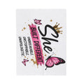 White plush blanket with large "Built Different" lettering and pink butterfly artwork