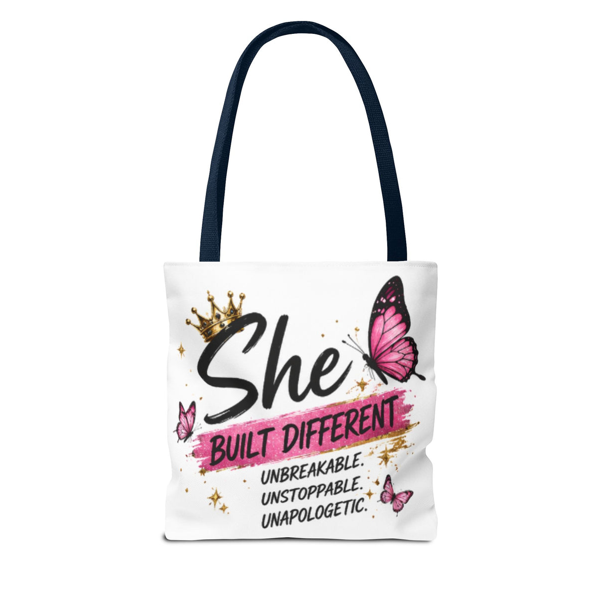 White canvas tote bag with navy handles and pink butterfly “She built different” design