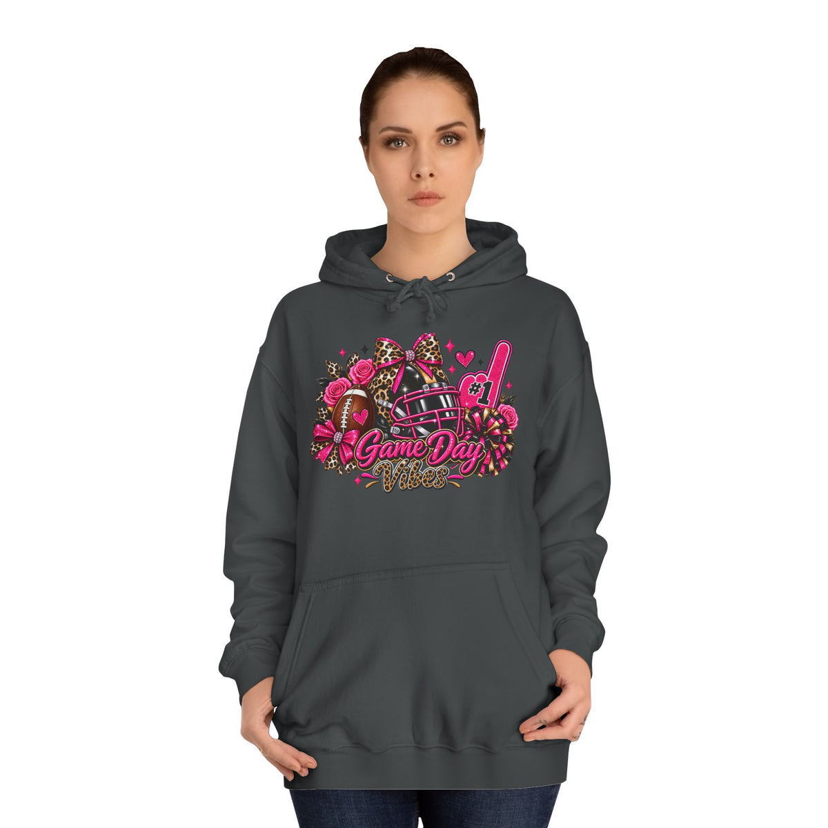 Game Day Cheer Hoodie — Pink Football Floral Design by Printify, modeled in a dark hoodie with a colorful pink football, floral, bow, and cheer graphic reading Game Day