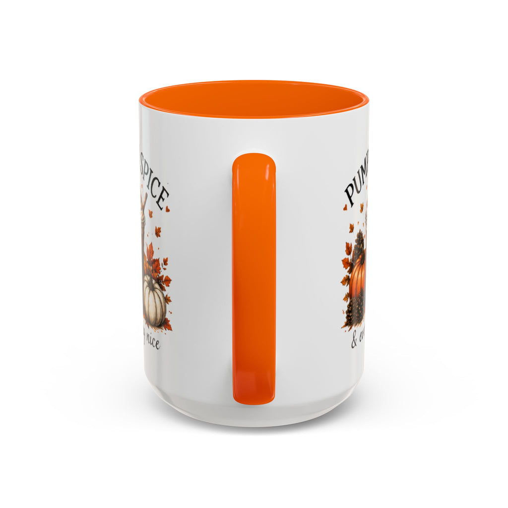 White coffee mug with orange vertical handle accent and partial “PUMPKIN SPICE” text.