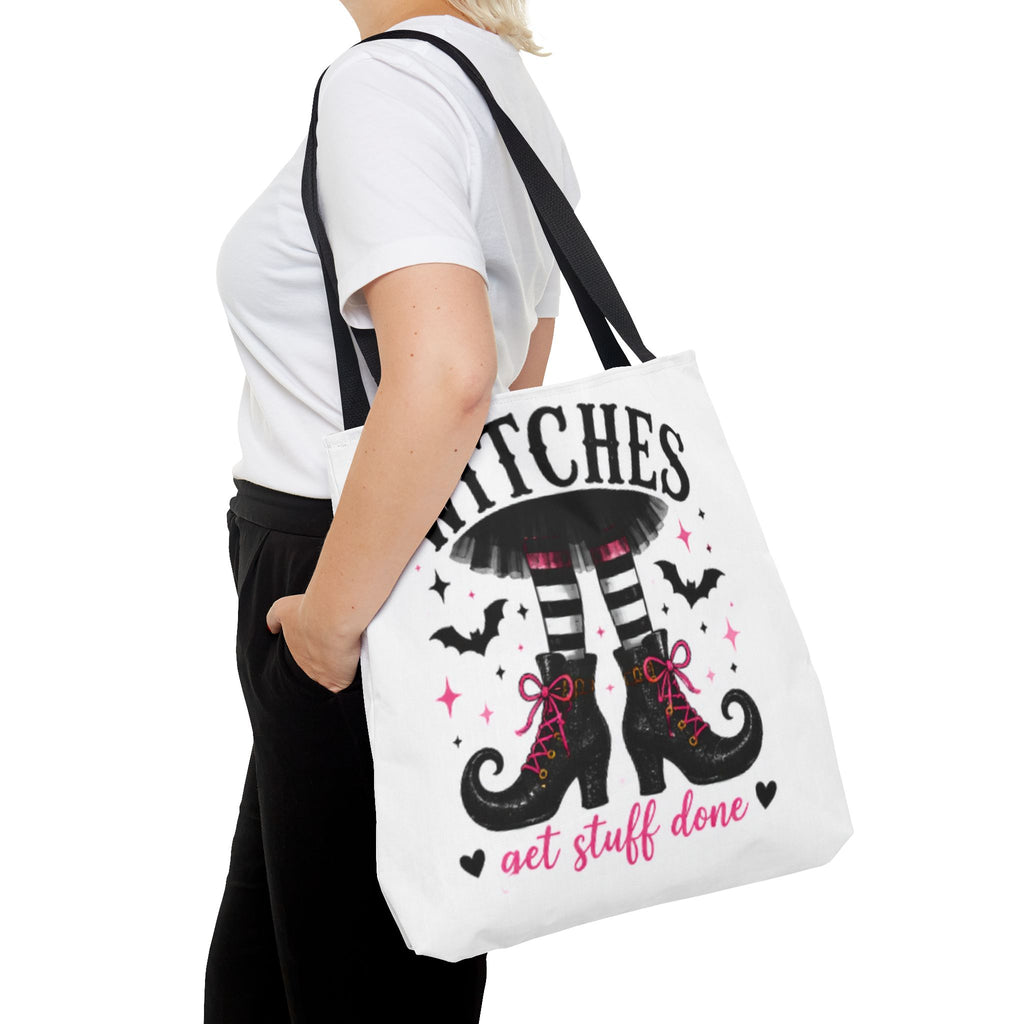 White tote bag with black handles and witch boots graphic, showing full front print.