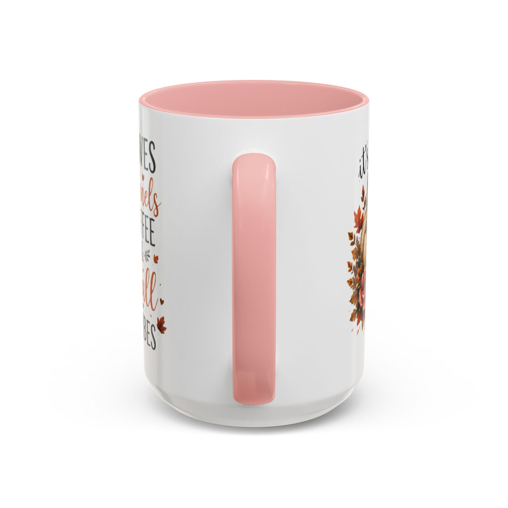White coffee mug with pink interior and handle, featuring autumn leaf and pumpkin print
