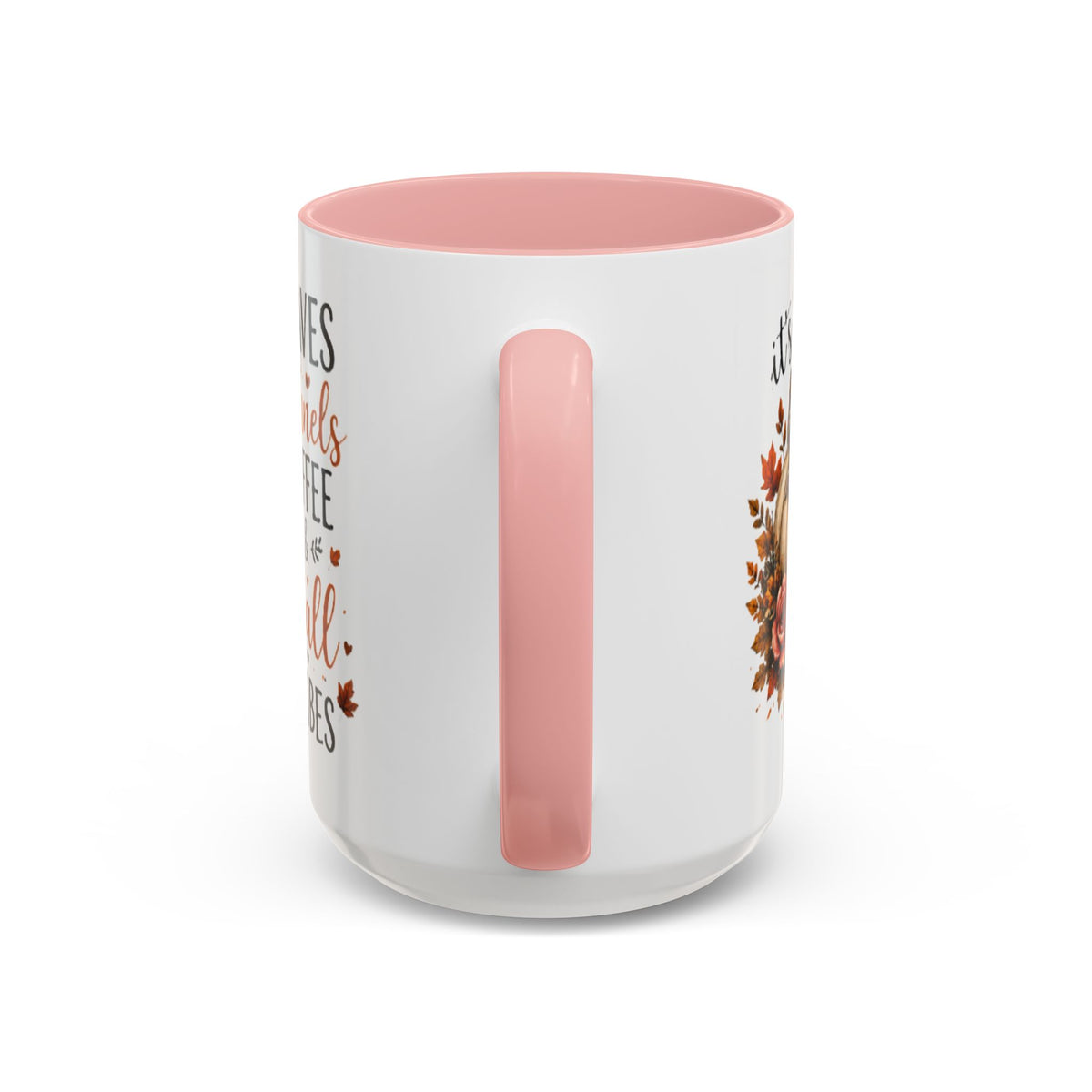 White coffee mug with pink interior and handle, featuring autumn leaf and pumpkin print