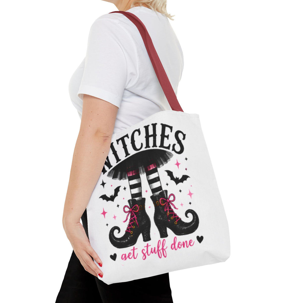 White canvas tote bag with burgundy handles and witch boots graphic, 'get stuff done' text.