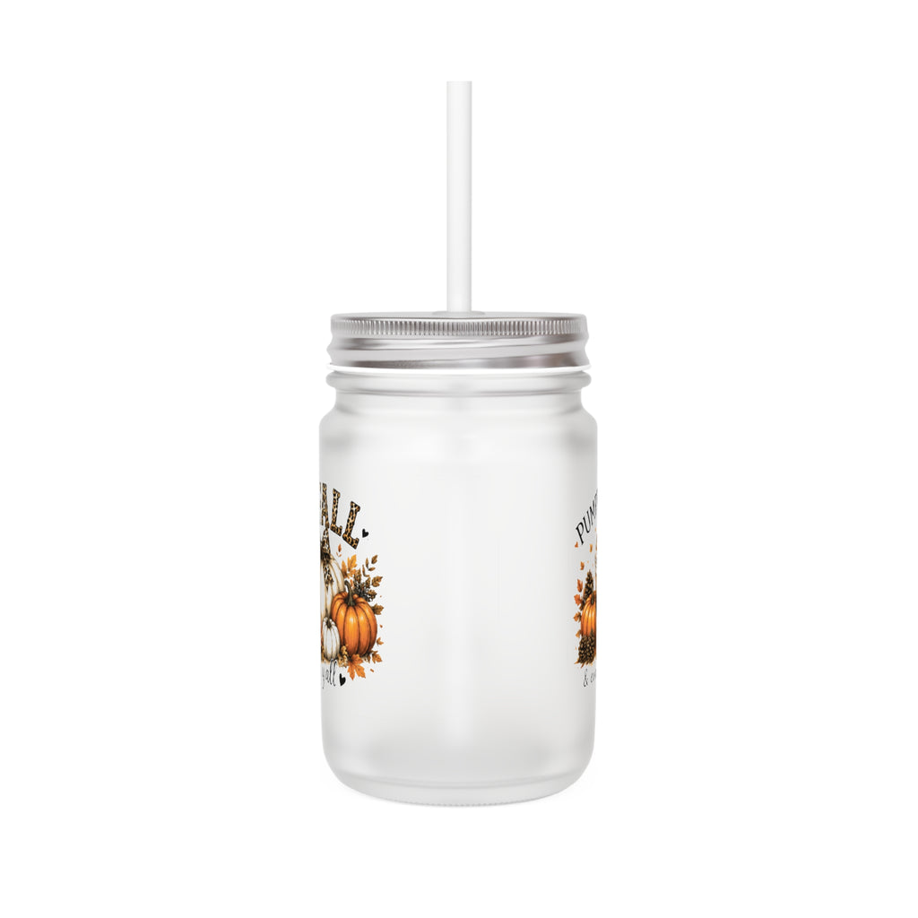 Frosted mason jar tumbler with straw, side view, and partial pumpkin graphic