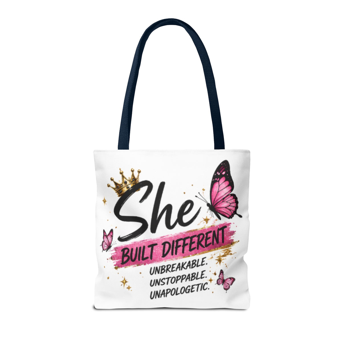 White tote bag with navy handles and pink butterfly “She built different” lettering graphic