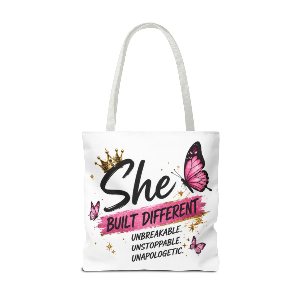 White tote bag with light gray handles, “She Built Different” butterfly graphic front.