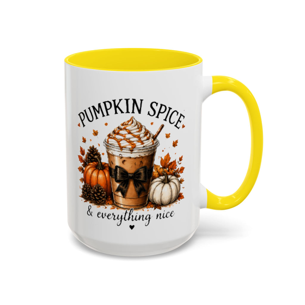 White coffee mug with yellow rim and handle, “PUMPKIN SPICE & everything nice” graphic.