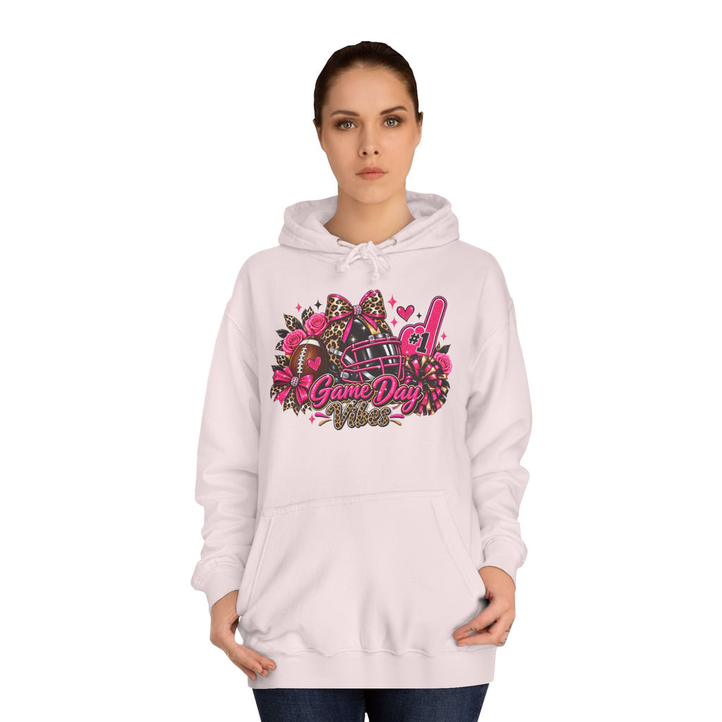 Game Day Cheer Hoodie — Pink Football Floral Design by Printify, modeled on a woman in a light pink hoodie with a colorful Game Day football graphic
