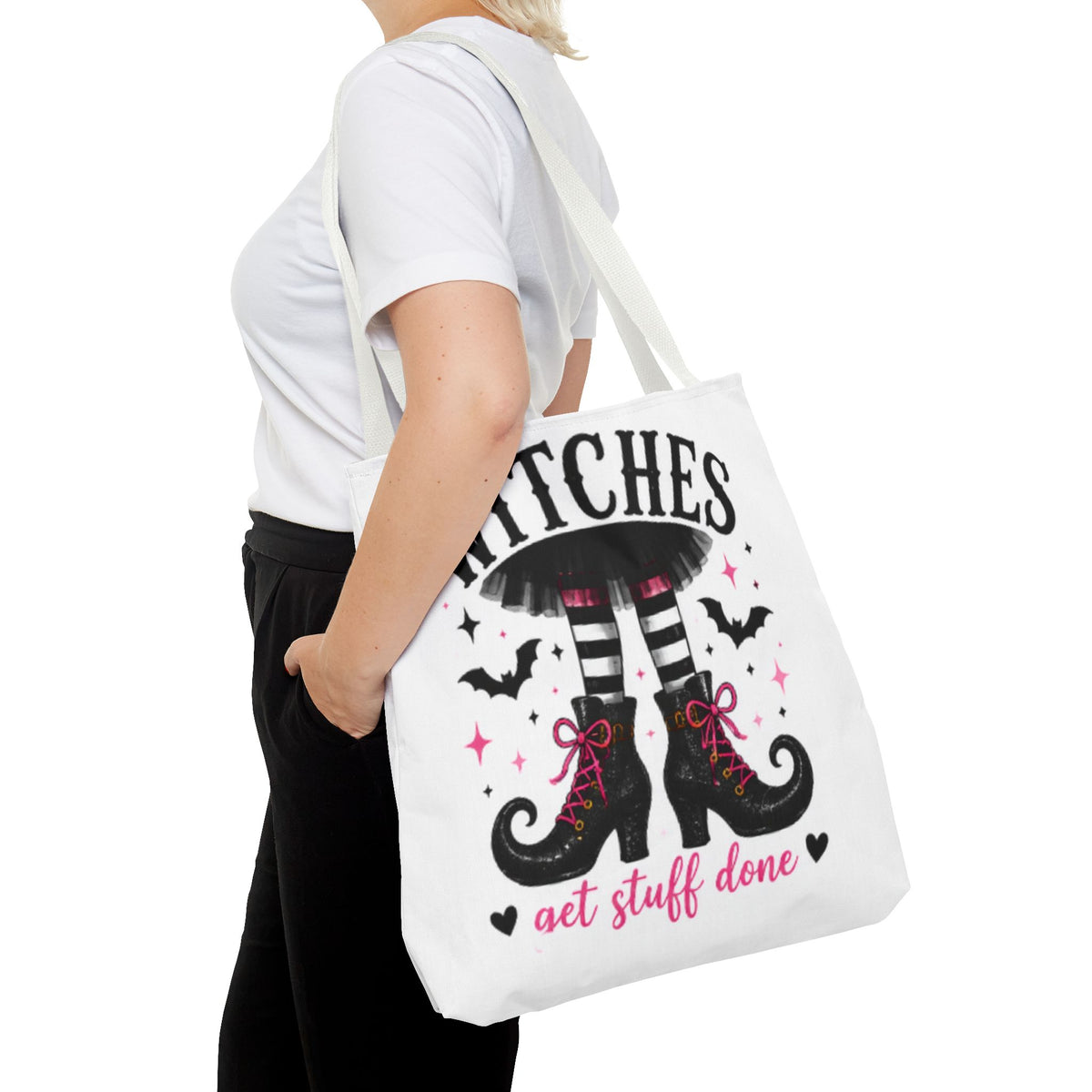 White canvas tote bag worn over shoulder with witch legs and 'get stuff done' text